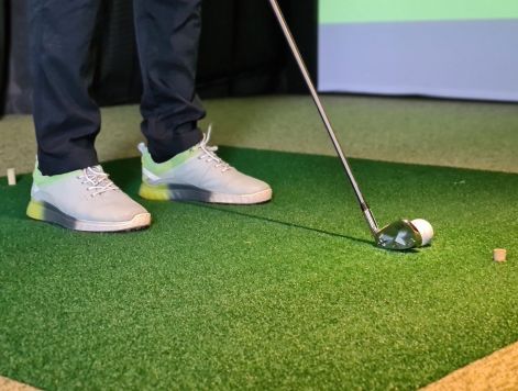 The Sloan at LoSo apartments in Charlotte, NC - inside golf simulator