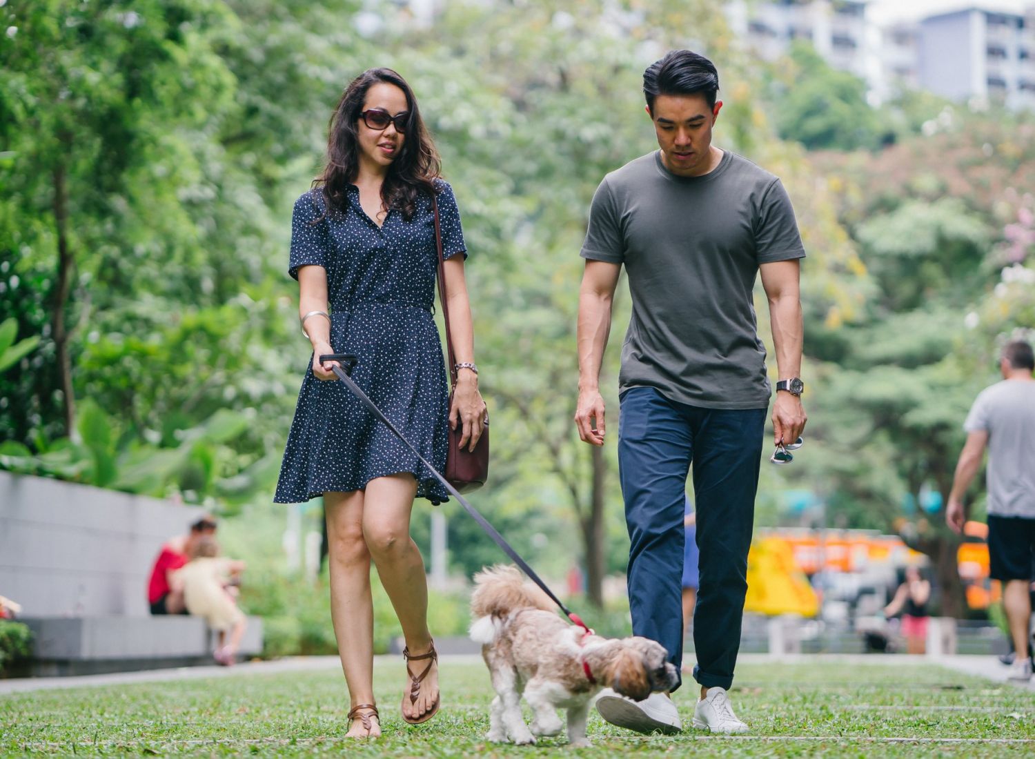 The Sloan at LoSo neighborhood couple walking their dog in the park